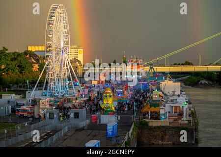 Kirmes Happy Colonia, Corona-compliant funfair at the Deutzer Werft, on the Rhine, Ferris wheel, Severinsbrücke, , Rhine, Rainbow, a temporary amuseme Stock Photo