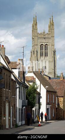 St Mary's  Street Eynesbury  with the tower of St Mary's church St Neots in background Vertical Format. Stock Photo