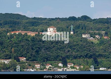 Colossus of San Carlo Borromeo and Church of Saint Charles Borromeo, San Carlo, Arona, Lake Maggiore, Piedmont, Italy Stock Photo