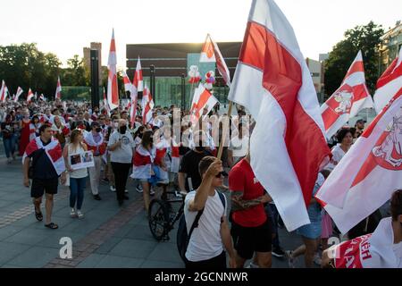 Wroclaw, Poland. 09th Aug, 2021. Demonstrators march while holding Belarusian flags during the demonstration.Demonstrators take part in a solidarity March with Belarus in Wroclaw, on the one-year anniversary of Belarus's alleged fraudulent presidential election. Credit: SOPA Images Limited/Alamy Live News Stock Photo