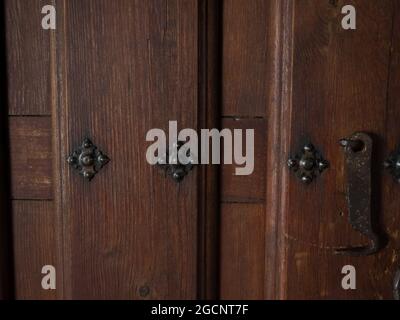 texture of a door with different veins and ornaments of iron painted in black Stock Photo