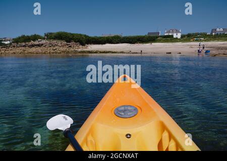 Kayaking / canoeing off Porthmellon Beach, St Mary's island, Isles of Scilly, Cornwall, England, UK, July 2021 Stock Photo