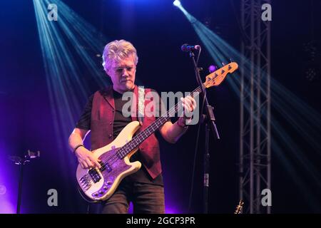 Wickham, UK. 08th Aug, 2021. Pat Davey, former bassist with the Tom Robinson Band and Seven, performing live on stage with Cregan & Co at Wickham Festival. Credit: SOPA Images Limited/Alamy Live News Stock Photo