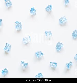 Blue ice cubes on white background. top view, copy space Stock Photo