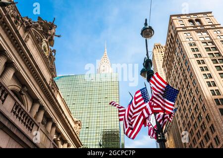 US flags on lamp-post outside Grand Central Station (Grand Central Terminus), New York City, NY, USA. Stock Photo