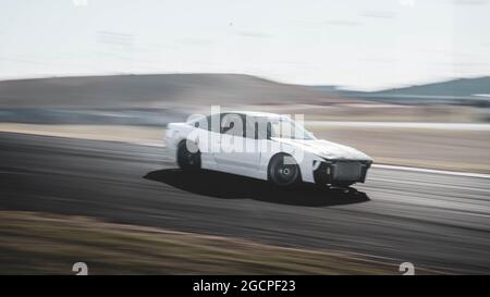 VicDrift Round 2: White Nissan 180SX drifts around Calder Park entertaining the crowd during a break in competition. Stock Photo