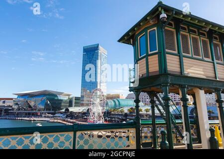 Sydney, Australia - October 14, 2020: Observation tower at Darling Harbour, Sydney. The pier opposite of Cockle Bay Wharf. A Ferris wheel in the back Stock Photo