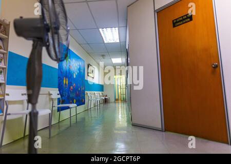 The empty waiting room of a doctor's office in Kuala Lumpur, Malaysia. Because of the Covid-19 Corona crisis, patients have to wait outside the polycl Stock Photo