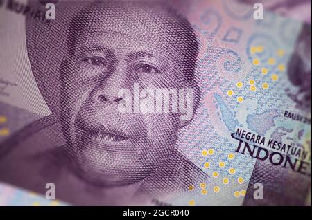 Close up of Indonesian banknotes. Rupiah is the indonesian currency. Here a bunch of 10000 rupiah. The money of indonesia. Indonesian rupiah has very Stock Photo