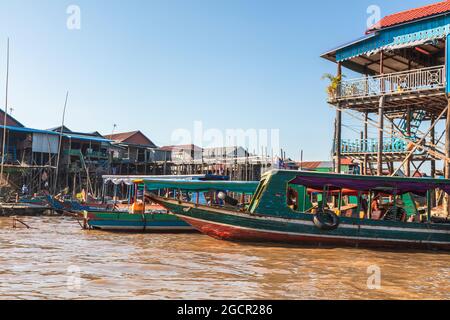 Kampong Phluk Floating Village on Tonle Sap lake near Siem Reap, Cambodia during sunset. The Stilt houses of the floating town. Exotic places South Ea Stock Photo