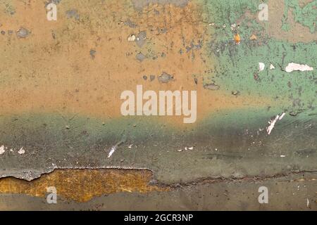 Old yellow and turquoise grunge background with paint peeling off Stock Photo