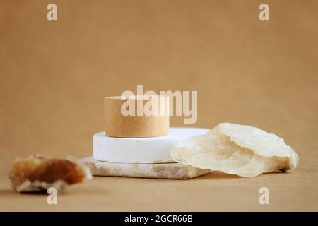 Abstract minimal scene with natural stones. cylinder wood podium on beige background. product presentation, mock up, show cosmetic product, Podium, stage pedestal or platform. Stock Photo