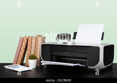 Compact home laser printer against gray background Stock Photo