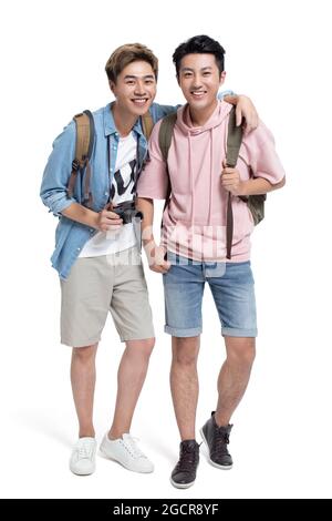 Happy young friends travelling together Stock Photo