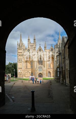 The arched entrance to the precincts and cathedral of St Peter, St Paul and St Andrew at Peterborough, England. Stock Photo