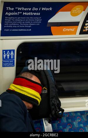 London, UK. 10th Aug, 2021. Mask confusion continues on the underground after the latest easing, particularly given the increased temperature. The tube is busier and masks are still obligatory but increasing numbers are ignoring the instruction led by mixed messages from the government. Credit: Guy Bell/Alamy Live News Stock Photo