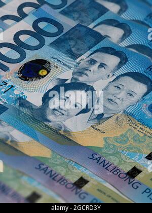 Front side of 1000 peso bill of the Philippines.A fan of 1000 Philippine Peso. Currency of the Island state. Bunch of thousand  Peso. Paper money or b Stock Photo