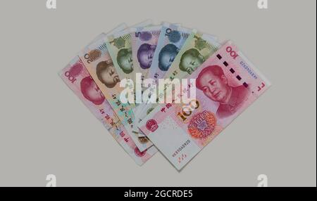 Fan of Chinese specimen banknotes. China renminbi or yuan on a white grey background. Close up to the Chinese paper currency. 1, 5, 10, 20 and 100 ren Stock Photo