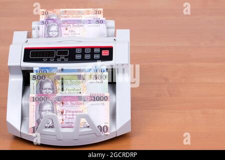 South Sudanese money in a counting machine Stock Photo