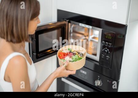 Heating Food in a Microwave Oven Stock Photo - Image of kitchen, door:  236057510