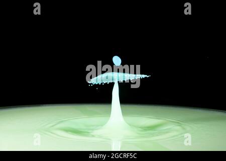 Close-up photograph of two water droplets colliding making an unusual pattern Stock Photo