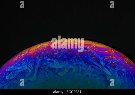 Incredible patterns formed on the surface of an ordinary soap bubble photographed in extreme close up Stock Photo