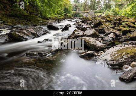 The Falls of Dochart are a cascade of waterfalls situated on the River Dochart at Killin in Stirling, Scotland, near the western end of Loch Tay. Stock Photo