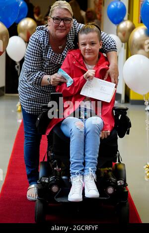 Ellie Curran with her mother Margie at Archbishop Blanch School in Liverpool, as students receive their A-Level results. Picture date: Tuesday August 10, 2021. Stock Photo