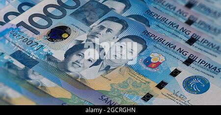 Front side of 1000 peso bill of the Philippines.A fan of 1000 Philippine Peso. Currency of the Island state. Bunch of thousand  Peso. Paper money or b Stock Photo