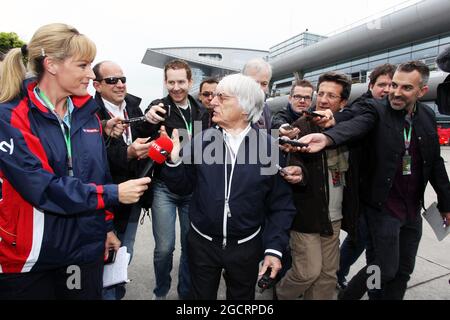 Bernie Ecclestone (GBR) CEO Formula One Group (FOM) with Rachel Brookes (GBR) Sky Sports News Presenter (Left) and othe members of the media. Chinese Grand Prix, Friday 13th April 2012. Shanghai, China. Stock Photo