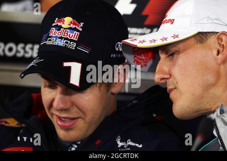 (L to R): Sebastian Vettel (GER) Red Bull Racing and Michael Schumacher (GER) Mercedes AMG F1 in the FIA Press Conference. German Grand Prix, Thursday 19th July 2012. Hockenheim, Germany. Stock Photo