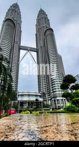 KUALA LUMPUR, MALAYSIA - Jan 29, 2020: A low angle shot of the scenic Petronas Twin Towers, a twin building complex in Kuala Lumpur Stock Photo