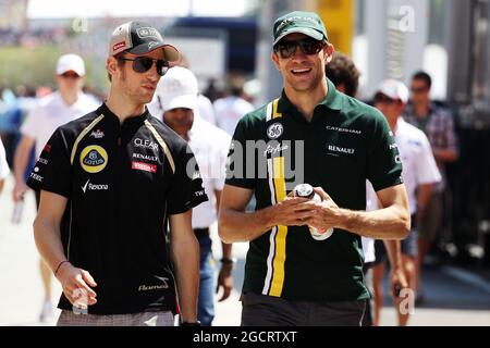 (L to R): Romain Grosjean (FRA) Lotus F1 Team with Vitaly Petrov (RUS) Caterham. Hungarian Grand Prix, Sunday 29th July 2012. Budapest, Hungary. Stock Photo
