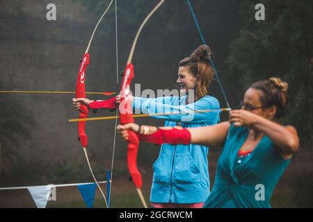 People take part in morning archery lessons in Ashton Court Estate, Bristol. Stock Photo