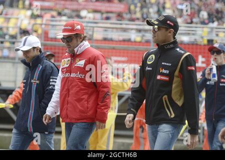 (L to R): Felipe Massa (BRA) Williams with Fernando Alonso (ESP) Ferrari and Pastor Maldonado (VEN) Lotus F1 Team on the drivers parade. Chinese Grand Prix, Sunday 20th April 2014. Shanghai, China. Stock Photo