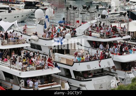 Fans on boats in the scenic Monaco Harbour. Monaco Grand Prix, Sunday 25th May 2014. Monte Carlo, Monaco. Stock Photo