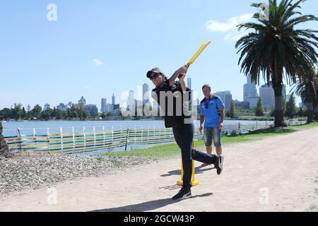 Sergio Perez (MEX) Sahara Force India F1 Team (Right) plays cricket in Albert Park with Brad Hodge (AUS) International Cricket Player. Australian Grand Prix, Tuesday 10th March 2015. Albert Park, Melbourne, Australia. Stock Photo