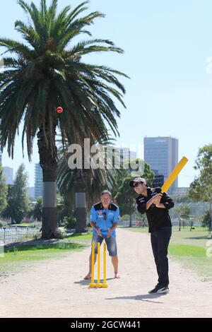 Sergio Perez (MEX) Sahara Force India F1 Team (Right) plays cricket in Albert Park with Brad Hodge (AUS) (Left) International Cricket Player. Australian Grand Prix, Tuesday 10th March 2015. Albert Park, Melbourne, Australia. Stock Photo