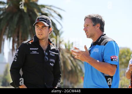 (L to R): Sergio Perez (MEX) Sahara Force India F1 Team plays cricket in Albert Park with Brad Hodge (AUS) International Cricket Player. Australian Grand Prix, Tuesday 10th March 2015. Albert Park, Melbourne, Australia. Stock Photo