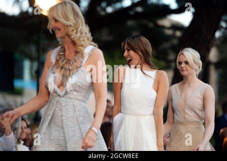 (L to R): Sonia Irvine (GBR); Jessica Button (JPN), wife of Jenson Button (GBR) McLaren; and epi, girlfriend of Emilia Pikkarainen (FIN), at the Amber Lounge Fashion Show. Monaco Grand Prix, Friday 22nd May 2015. Monte Carlo, Monaco. Stock Photo