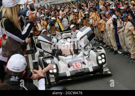 Race winners Nico Hulkenberg (GER) / Earl Bamber (NZL) / Nick Tandy (GBR) #19 Porsche Team Porsche 919 Hybrid celebrate at the end of the race. FIA World Endurance Championship, Le Mans 24 Hours - Race, Sunday 14th June 2015. Le Mans, France. Stock Photo