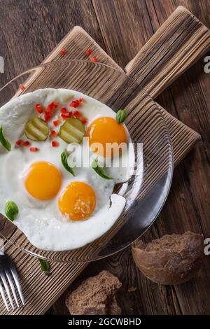 Fried eggs from two eggs on a plate, top view, healthy breakfast concept Stock Photo