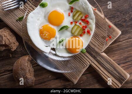 Fried eggs from two eggs on a plate, top view, healthy breakfast concept Stock Photo