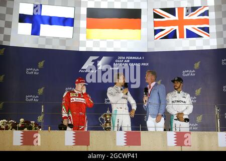 The podium (L to R): Kimi Raikkonen (FIN) Ferrari, second; Nico Rosberg (GER) Mercedes AMG F1, race winner; David Coulthard (GBR) Red Bull Racing and Scuderia Toro Advisor / Channel 4 F1 Commentator; Lewis Hamilton (GBR) Mercedes AMG F1, third. Bahrain Grand Prix, Sunday 3rd April 2016. Sakhir, Bahrain. Stock Photo