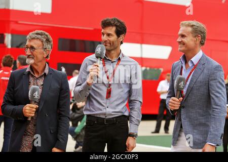 (L to R): Eddie Jordan (IRE) with Mark Webber (AUS) Porsche Team WEC Driver / Channel 4 Presenter and David Coulthard (GBR) Red Bull Racing and Scuderia Toro Advisor / Channel 4 F1 Commentator. British Grand Prix, Saturday 9th July 2016. Silverstone, England. Stock Photo