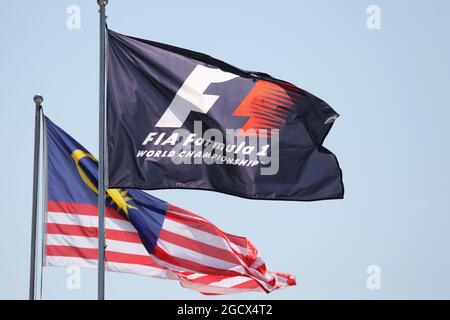 F1 and Malaysian flags. Malaysian Grand Prix, Friday 30th September 2016. Sepang, Kuala Lumpur, Malaysia. Stock Photo