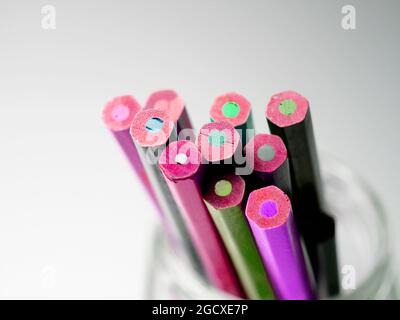 Different colored pencils in a glass Stock Photo