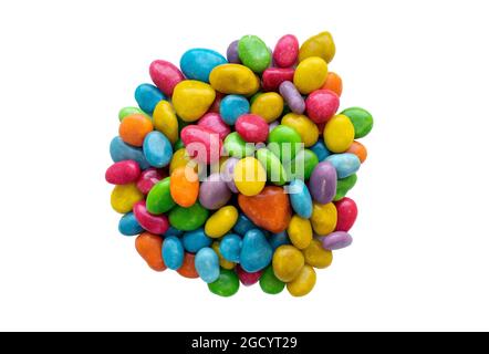 Pile of colorful candy dragee, multi-colored glazed raisins isolated on white background. Heap of multi-colored glazed raisins, sweets. Top view. Stock Photo