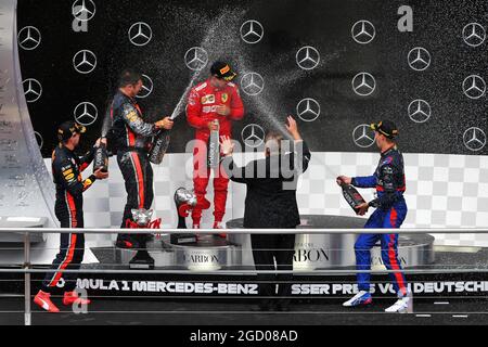 Race winner Max Verstappen (NLD) Red Bull Racing celebrates on the podium with Sebastian Vettel (GER) Ferrari and Daniil Kvyat (RUS) Scuderia Toro Rosso. German Grand Prix, Sunday 28th July 2019. Hockenheim, Germany. Stock Photo