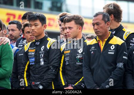 F1, F2, and F3 pay their respects to Anthoine Hubert (L to R): Ye Yifei (CHN) Renault Sport Academy Driver; Max Fewtrell (GBR) Renault Sport Academy Driver; Mia Sharizman (MAL) Renault Sport Academy Director. Belgian Grand Prix, Sunday 1st September 2019. Spa-Francorchamps, Belgium. Stock Photo